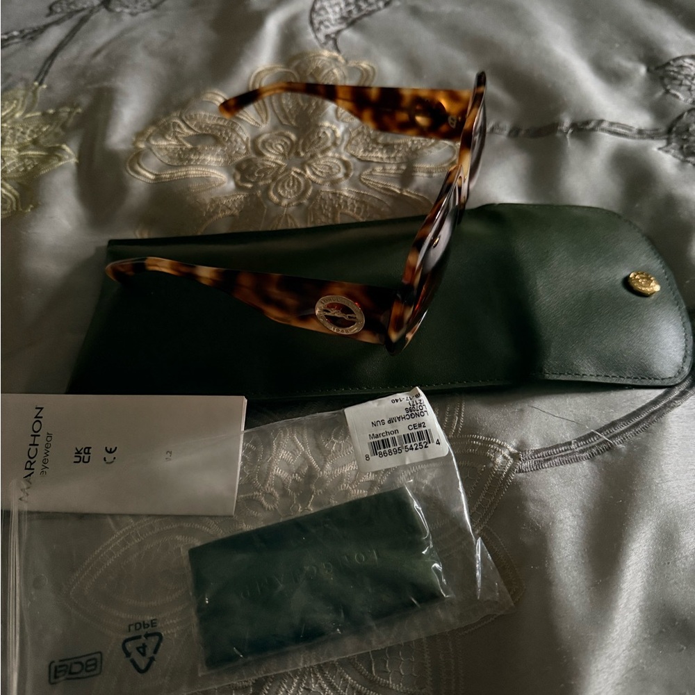 Brand new Long champ  Tortoise Shell Sunglasses with Green Case.